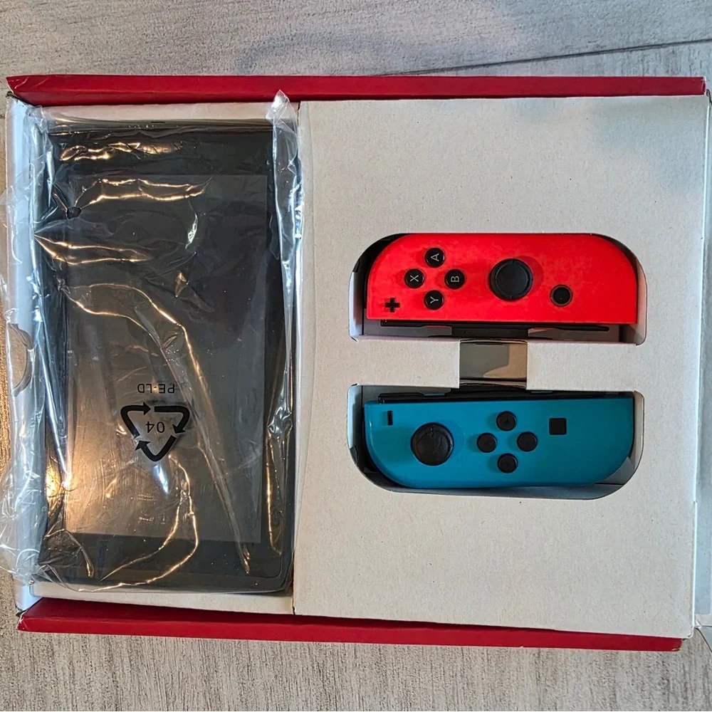 Nintendo Switch with Neon Blue and Neon Red Joy-Con - Handheld Gaming Console - Picture 5 of 9